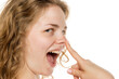 © vladimirfloyd - Happy woman touching nose, suggesting rhinoplasty. Profile, curly blonde hair, no makeup, white background