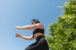 © StockRojoVerdeyAzul - A woman performs arms and leg exercises for a sunny day in Zaragoza, Spain