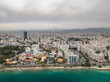 © AmazingAerialAgency - Aerial view of beautiful coastal cityscape with modern architecture and high-rise buildings along the sea, Limassol, Limassol, Cyprus.