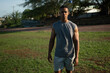 © Lester - Young male athlete recovering after training on a sports field