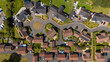 © AmazingAerialAgency - Aerial view of a picturesque suburban neighborhood with modern homes and organized streets, Exeter, United Kingdom.