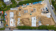 © AmazingAerialAgency - Aerial view of new residential construction site with buildings and equipment, Bude, United Kingdom.