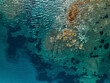 © AmazingAerialAgency - Aerial view of a colorful lagoon in Santa Maria La Palma, Sardinia, Italy.