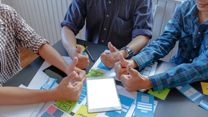 Wall Mural - web designers are working together to develop mobile responsive website with ui ux front end designe