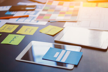 Wall Mural - web designers are working together to develop mobile responsive website with ui ux front end designe