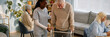 © Seventyfour - Senior man using walker being assisted by nurse in elderly care facility