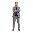 © ibig - Confident businessman crossing arms office setting portrait professional environment corporate perspective