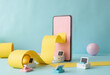 © starush - Colorful mockup of a smartphone with yellow paper roll and cute stationery