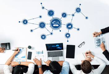 Poster - Aerial view of a business meeting with professionals analyzing graphs and charts on their laptops and documents, highlighting teamwork and digital data strategies in modern offices. Amity