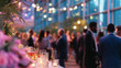 © Mehdi - Blurred view of business professionals at a corporate party or office event in a modern conference center