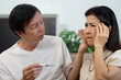 © Natee Meepian - Wellness and Emotional Support. Elderly couple sharing concern during health check.