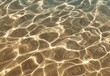 © hits - Sunlit shallow water reveals a sandy seabed through shimmering, rippling surface patterns