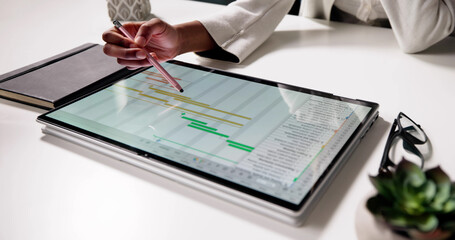 Poster - Financial Analysts Review Data Charts On Laptop