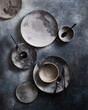 © ADDICTIVE STOCK - Top view of an elegant set of ceramic tableware on textured surface