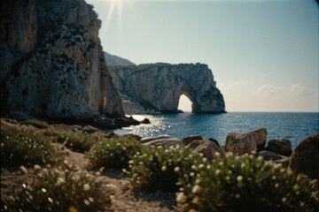 Wall Mural - A scenic view of the ocean from a rocky shore, ideal for use in travel or outdoor-themed projects