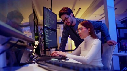 Asian software engineer or programmer team working late in development office,problem solving or algorithm of ai assistant helping for work.software developer,digital technology security concept