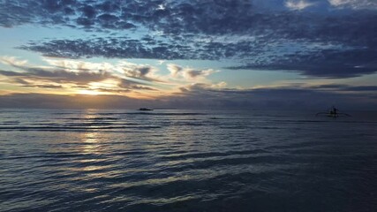 Wall Mural - Vibrant sunrise over sea with clouds and waves, beach scene, peaceful nature, Philippines, 4k