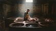 © Firman Dasmir - Artisan crafting leather in traditional tannery vats under a skylight