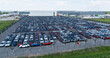 © scharfsinn86 - Aerial view of a storage facility for new cars