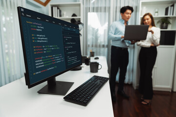 running on coding programming intelligence system on computer screen with blurry it developers stand