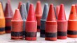 © Insight - Colorful Crayon Army Vivid Red with Orange, and and Gray Standing Tall.