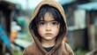 © Nawarit - A child with tattered clothing standing in front of a poorly built house, Poverty, Raw and heartwrenching