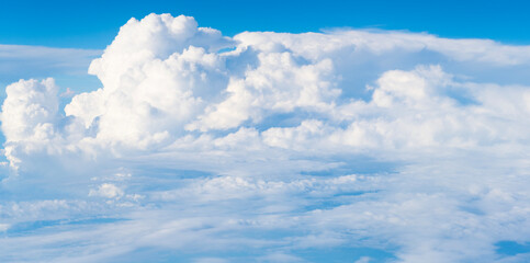 Wall Mural - Blue sky with clouds in the sky. Sky clouds background. White cloudy Heaven with soft sun light. Clouds on pastel blue sky background.