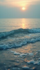 Poster - Serene ocean waves roll gently towards the shore at sunrise, shimmering with warm light.