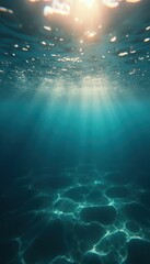 Leinwandbilder - Underwater sunlight beams illuminate serene ocean floor patterns in blue depths.