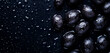 © Aamir - Close-up of black grapes with water droplets on dark background, perfect for wine promotions, organic fruit ads or fresh produce marketing visuals