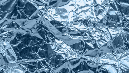 Wall Mural - shiny metallic blue foil crumpled texture background