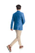 © Viorel Sima - rear view of smart casual guy with blue jacket walking