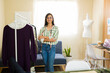 © AntonioDiaz - Clothing designer standing proudly in her creative workspace