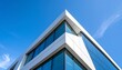 © sala - A crisp image showcasing the juxtaposition of a contemporary building's sharp angles