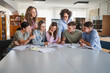 © Miljan Živković - Group of high school students work on project with teacher in library