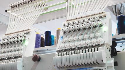 Poster - Sewing equipment, loom equipment at a garment factory, industrial concept background