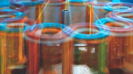 Poster - Machine spinning red yarn, machine spinning and motion blur