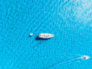 Wall Mural - summertime vacation. sailing yacht at sea. drone view on the yacht. .sea and waves from top view. vi