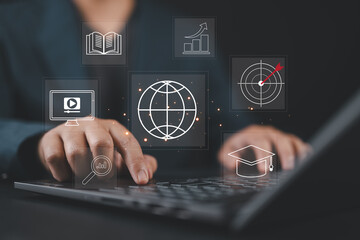 Leinwandbilder - Businessman using computer laptop for learning online internet lessons. E-learning education concept.