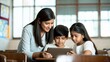 © N7 - Indian Teacher and Kids Interacting with Educational Tablet in School
