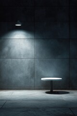 Wall Mural - a dimly lit concrete room features a small, round, white table centrally positioned, illuminated by 
