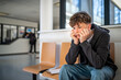 © Halfpoint - Anxious teenager waiting alone in hospital waiting area before medical checkup.