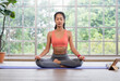 © weedezign - young healthy woman practice yoga mudra on a mat at home, in a yoga sitting position