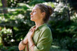 © Rido - Woman practicing meditation with a feeling of gratitude and peace