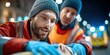 © AnuStudio - Paramedics provide urgent care to a patient outdoors at night, showing concern and focus during an emergency situation.