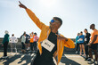 © Jacob Lund - Male athlete striking a pose at outdoor running event