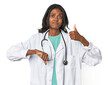 © Asier - Young Indian doctor with stethoscope showing thumbs up and thumbs down, difficult choose concept