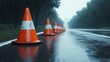 © Fadil - Wet road cones in rain