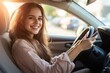 © Ольга Лукьяненко - Happy woman driving car using smartphone