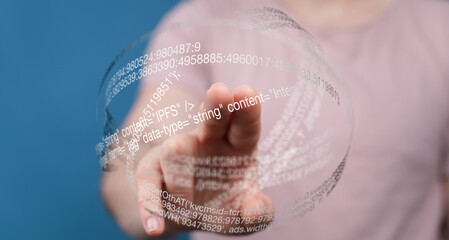 Aufkleber - Close-up of a person's hand interacting with a digital sphere of data, showcasing modern technology.